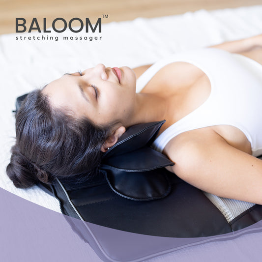 Baloom Stretching Massager massages your neck and shoulders to soothe sore muscles.